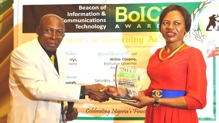 Success Nmerife, Head Marketing Communications, Computer Warehouse Group Plc, (r) receiving the ecommerce platform of the year award from Mr. Chris Uwaje, former President, Institute of Software Practitioners of Nigeria (ISPON), at the BoICT awards held in Lagos